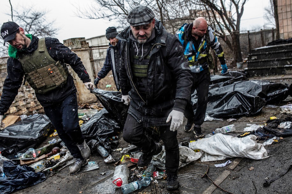 Burying civilian casualties in Bucha, Ukraine (Credit: Washington Post)